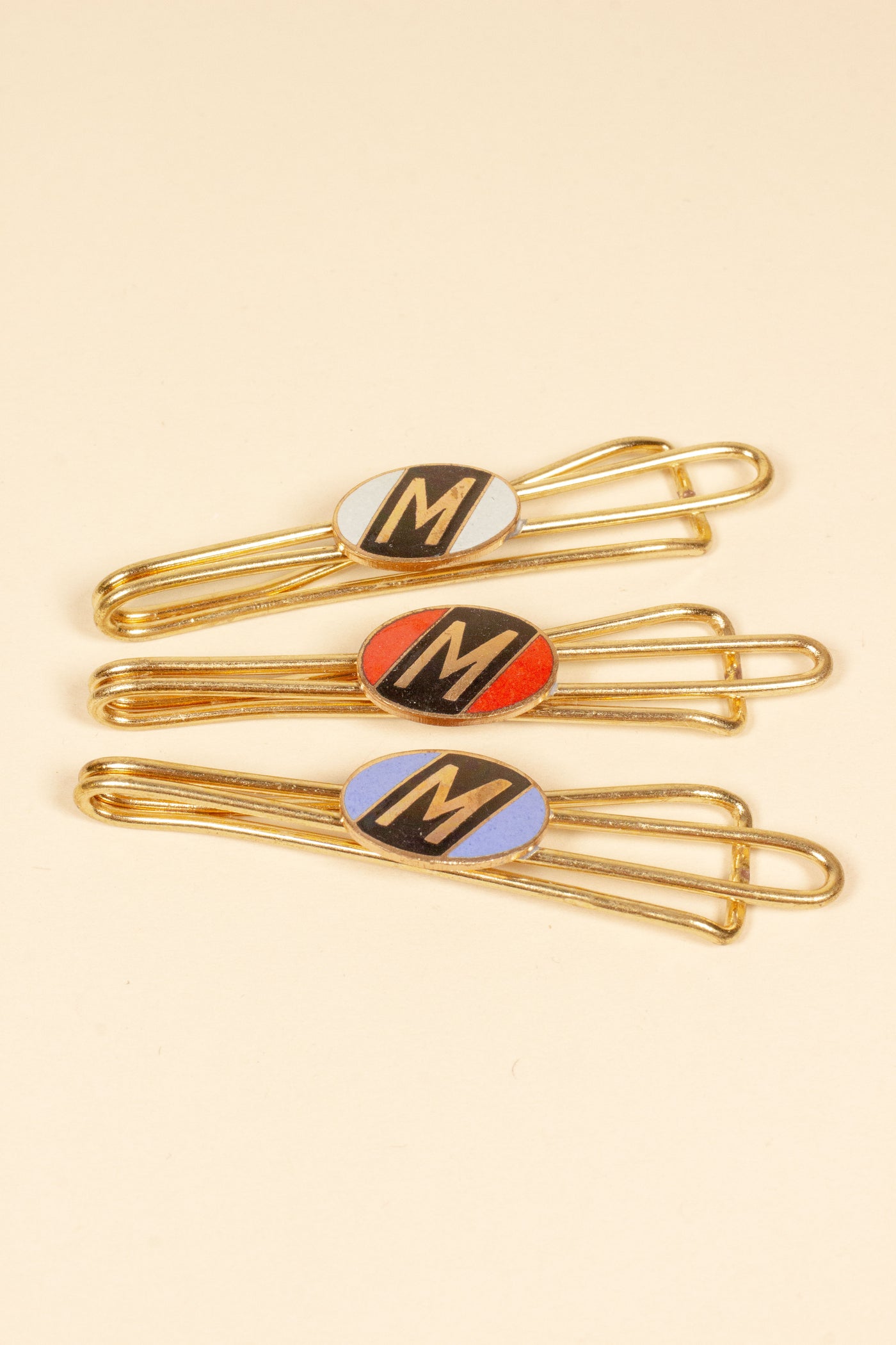 1930/1940s ENAMELED NEW OLD STOCK BRASS TIE CLIPS WITH INITIAL, LETTER "M"