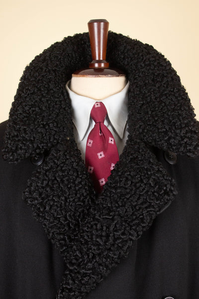 SWEDISH 1910S/1920S BLACK OVERCOAT WITH PERSIAN COLLAR AND FUR LINING, BY PAUL U. BERGSTRÖM. SIZE CA EU 48