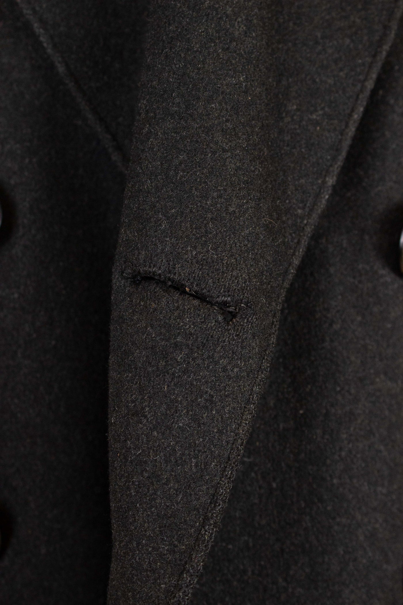 SWEDISH 1920S DARK GREY CHESTERFIELD COAT BY CARL H. SCHULTZ. SIZE CA EU 52-54