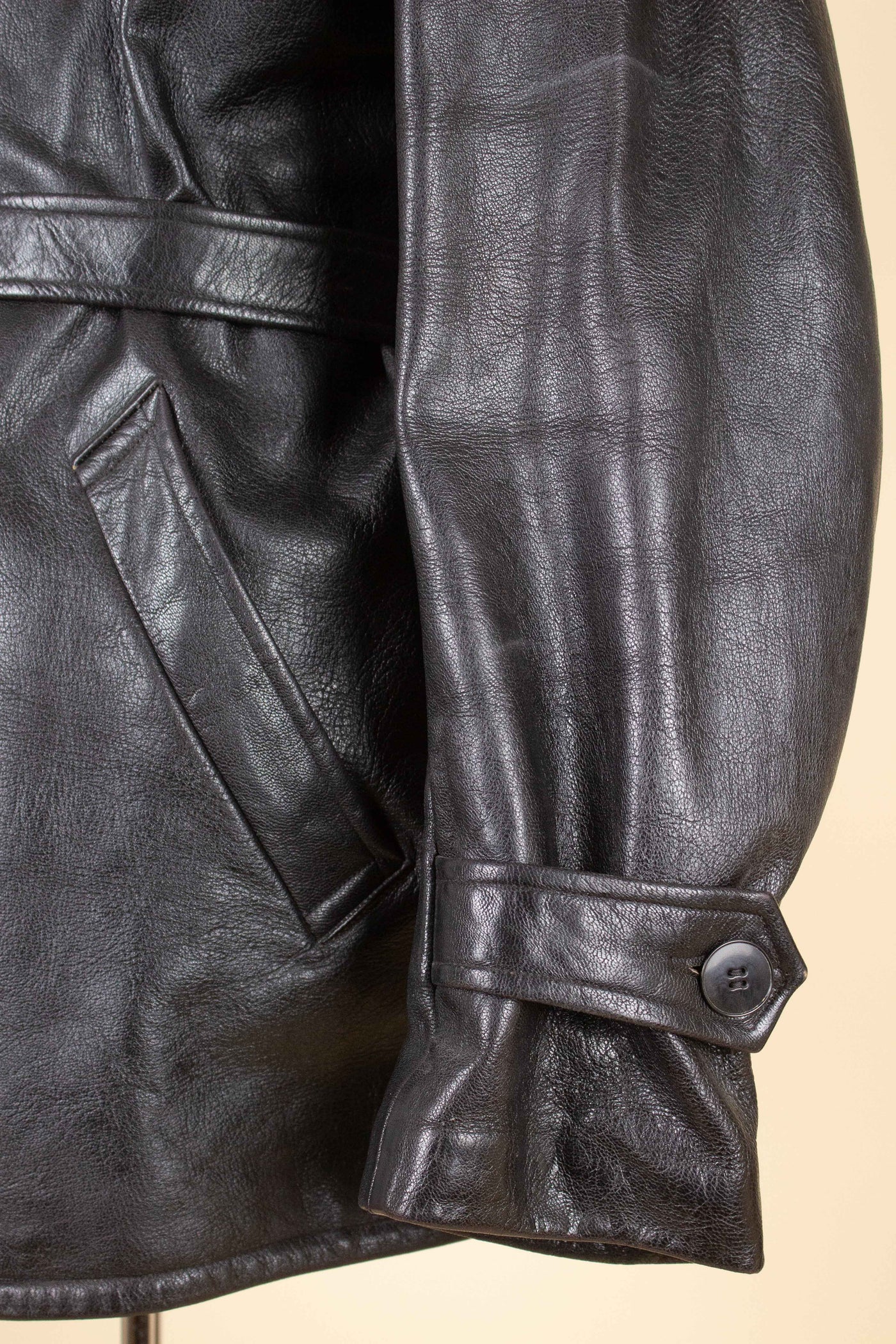 SWEDISH 1940S BLACK DOUBLE BREASTED BELTED GOATSKIN JACKET BY L.F. EMILSSON. SIZE CA EU 52