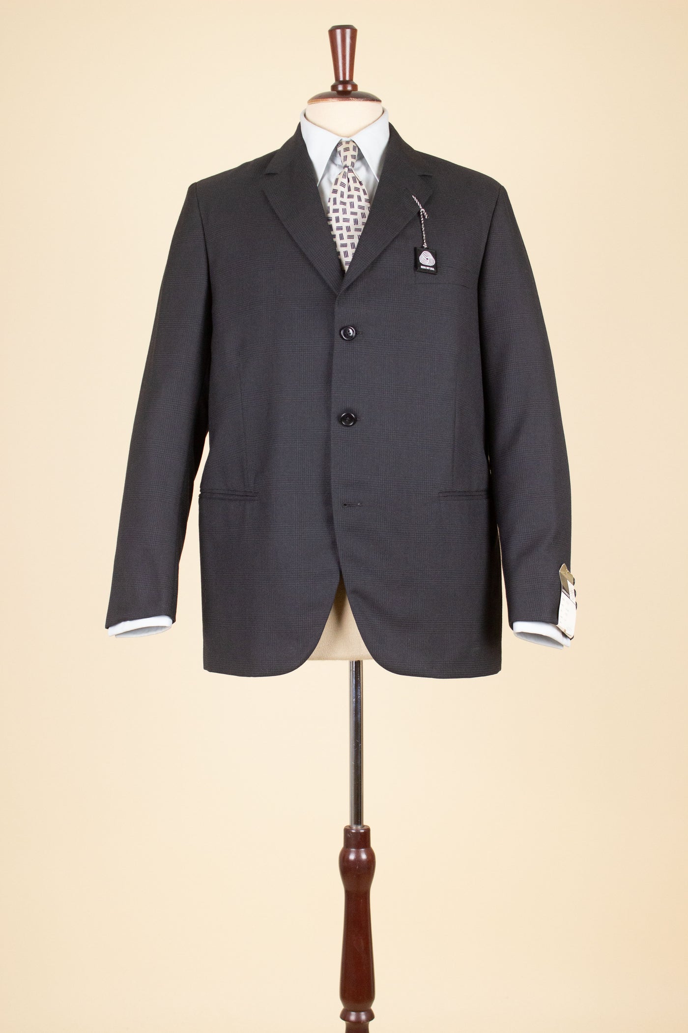 SWEDISH 1960S DARK GREY TWO PIECE SINGLE BREASTED DEADSTOCK SUIT BY UNKNOWN MAKER. SIZE CA EU 48
