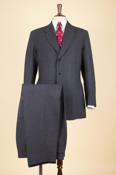 BRITISH 1961 DARK GREY TWO PIECE SINGLE BREASTED SUIT BY ANDERSON & SHEPPARD. SIZE CA EU 48