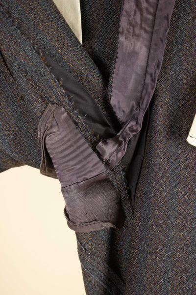 BRITISH 1950S/1960S BROWN-GREEN TWO PIECE SINGLE BREASTED BESPOKE SUIT. SIZE CA EU 52-54