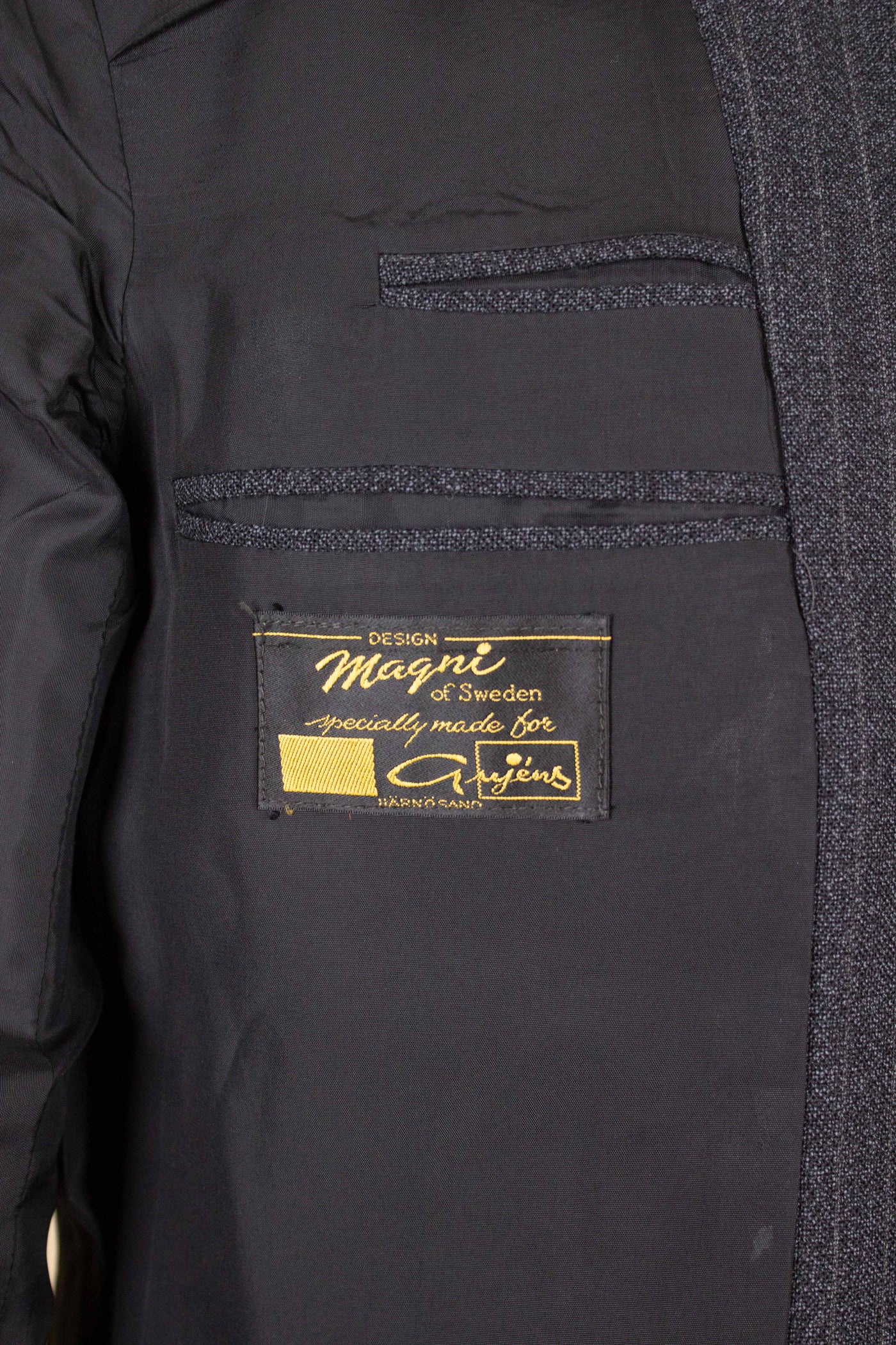 SWEDISH 1960S DARK GREY PINSTRIPED SINGLE BREASTED SUIT BY MAGNI. SIZE CA EU 48