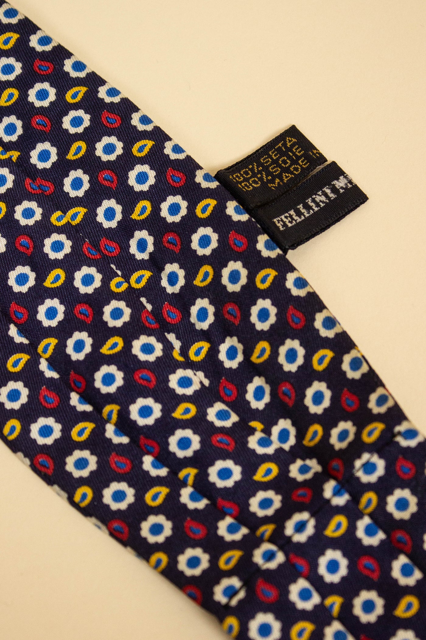 ITALIAN 100%SILK DARK BLUE ASCOT TIE WITH SMALL YELLOW, WHITE, RED AND BLUE PAISLEY PATTERN