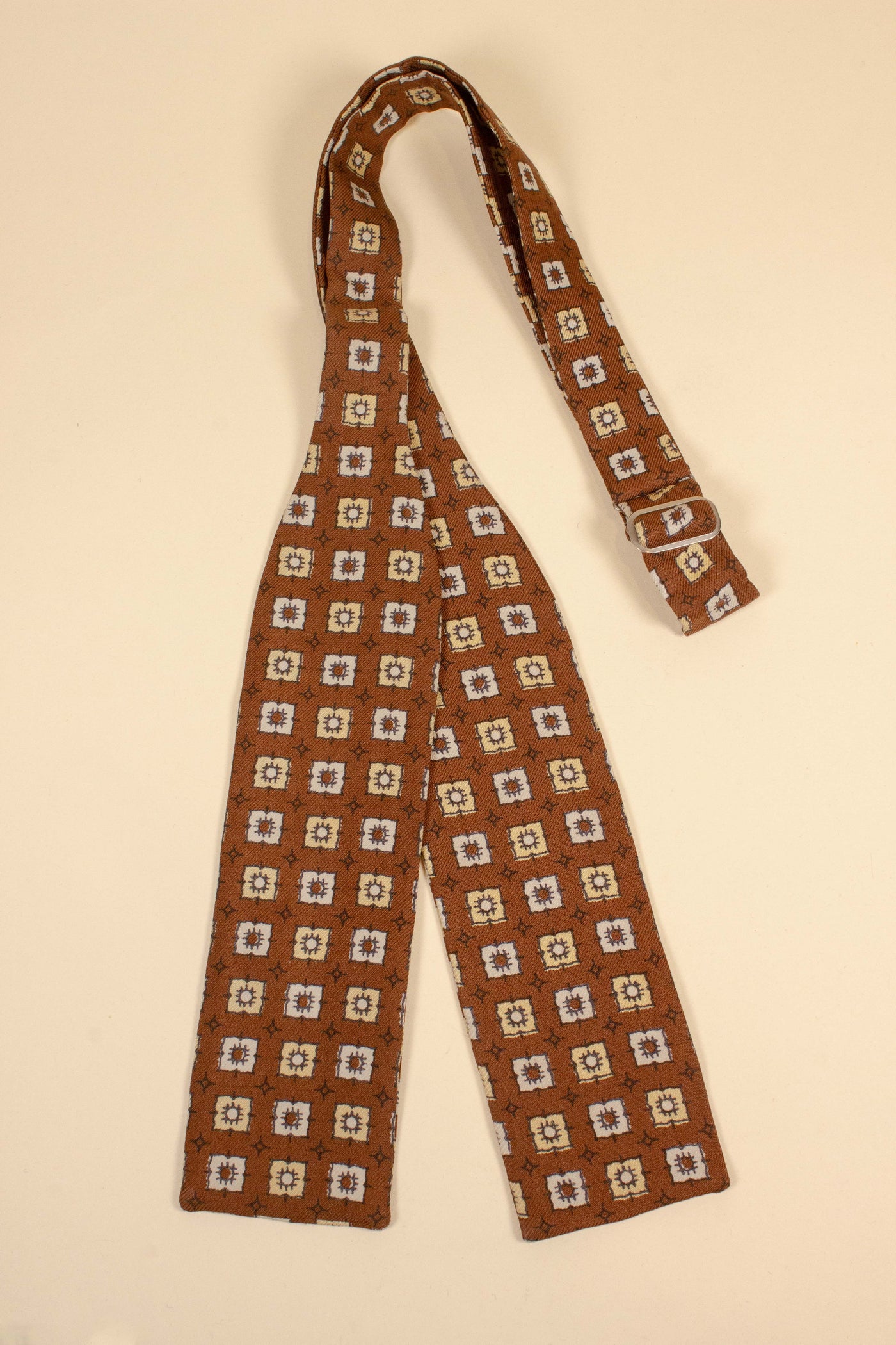 1940s/1950s brown bow tie with white and cream pattern