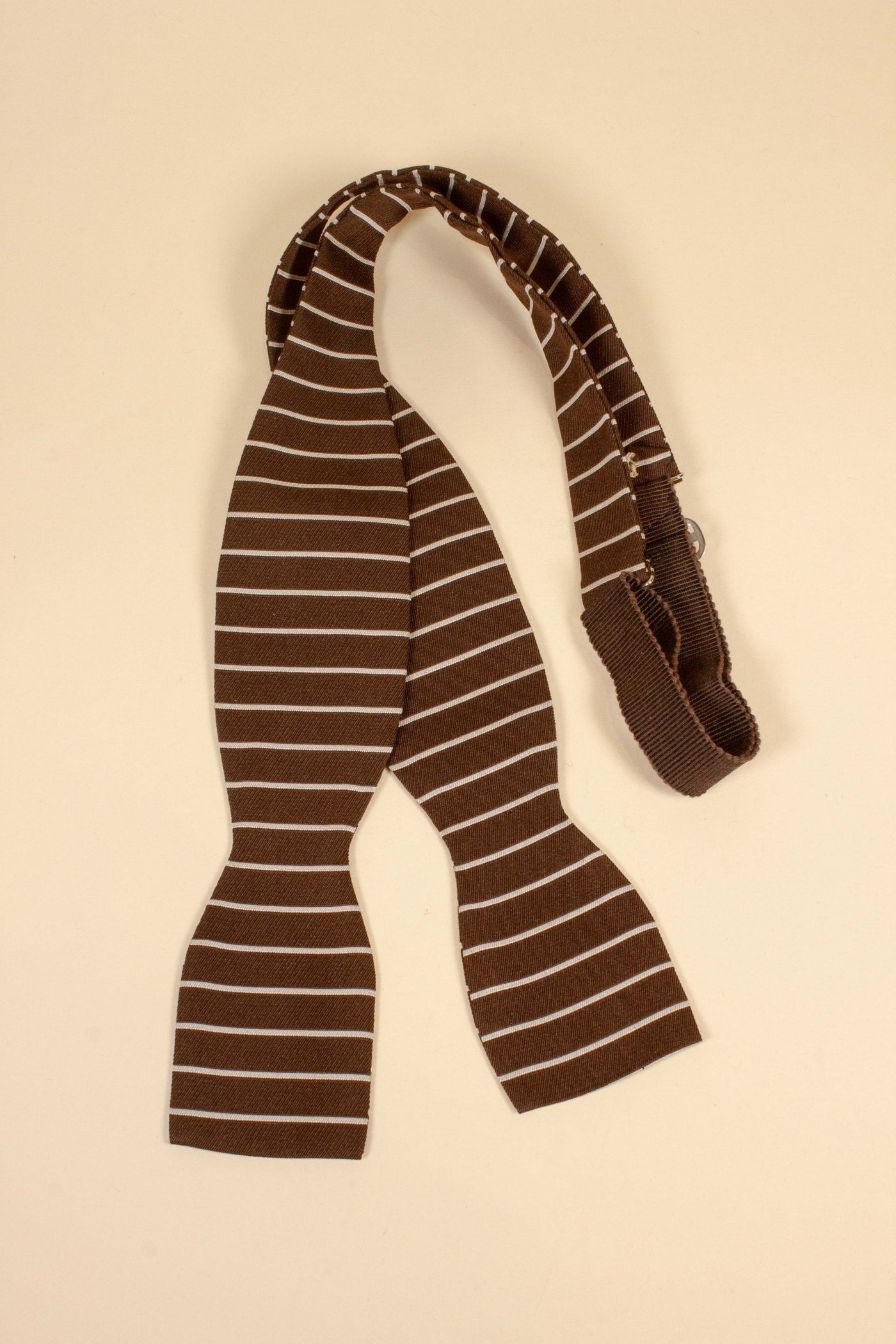 1940s/1950s brown bow tie with white vertical stripes