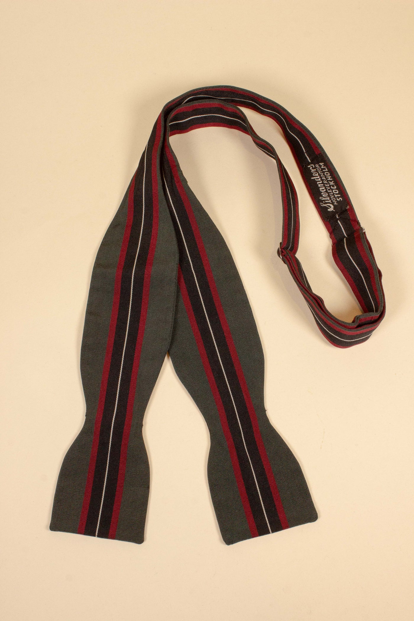 1940s/1950s green bow tie with red, black and white stripes