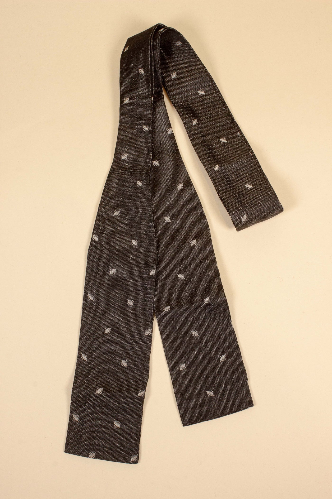 Early 1900 dark grey bow tie with white pattern