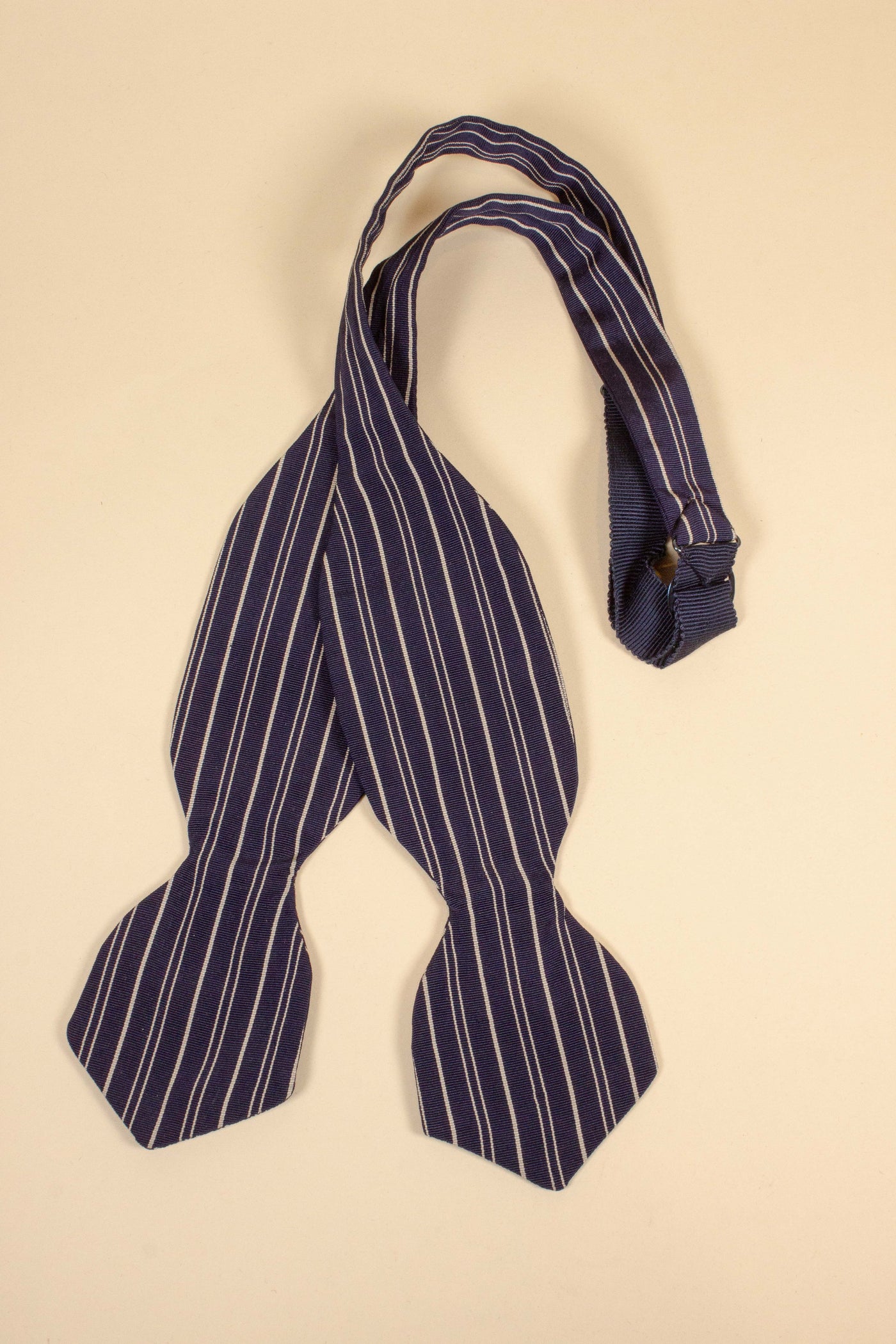 1940s/1950s dark blue bow tie with white stripes