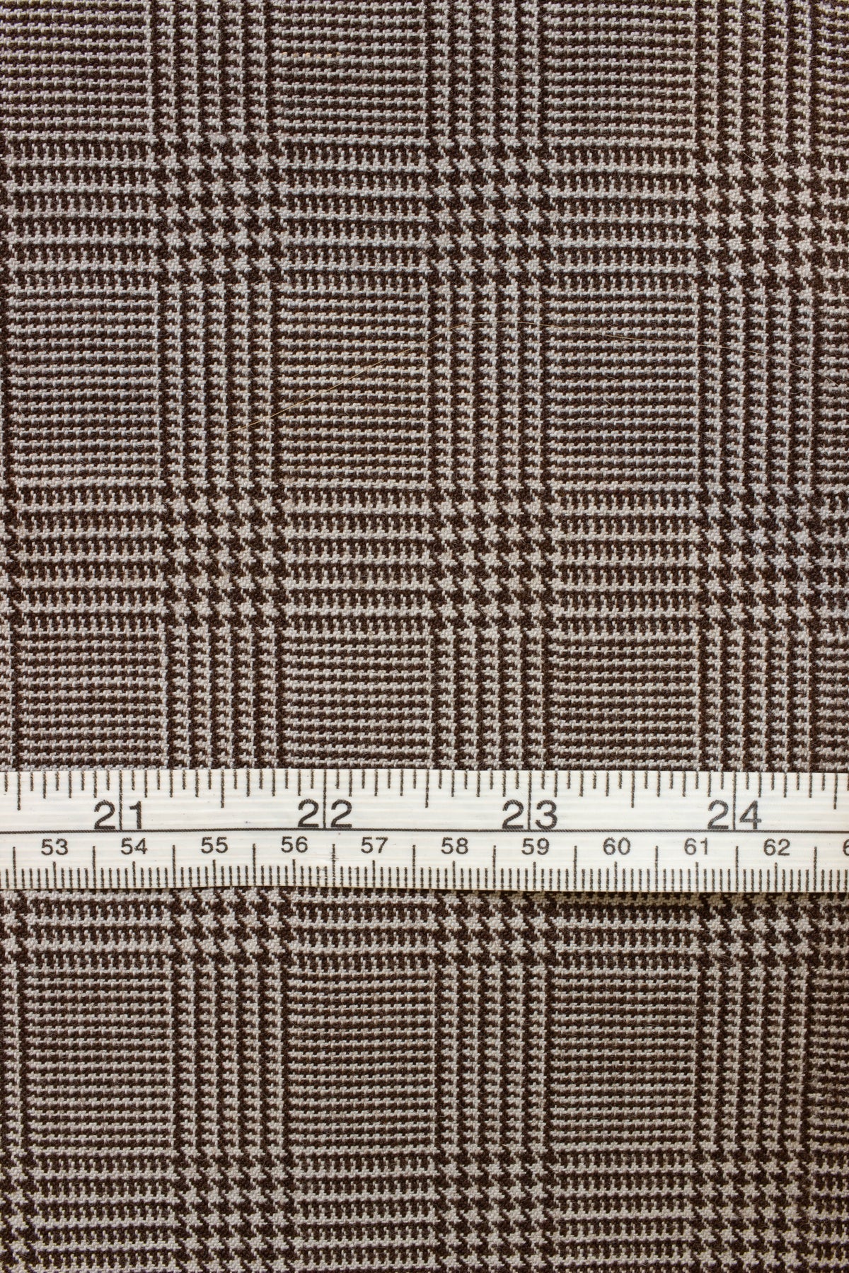 1940s/1950s dark brown prince of wales check. Width 150 cm
